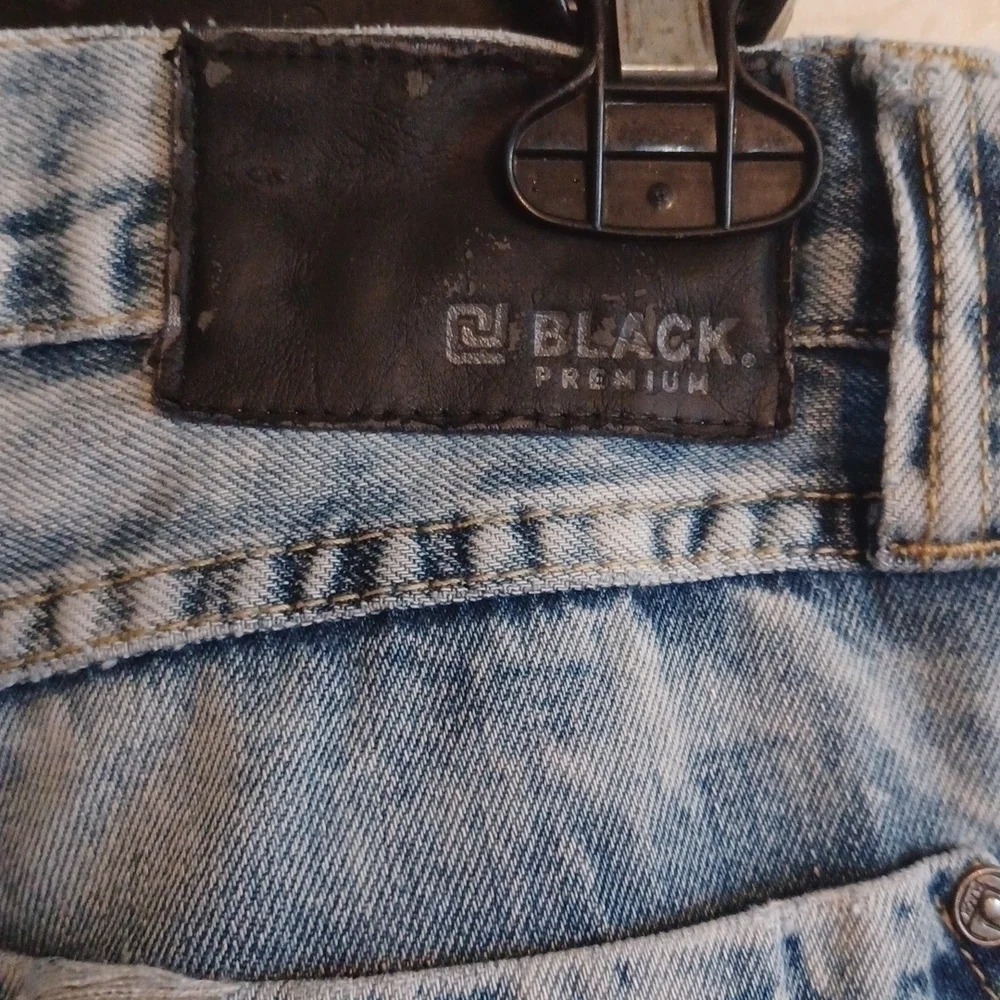 Black brand super distressed, acid wash looking jeans.Size 30x32.